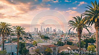 Beautiful sunset of Los Angeles downtown skyline and palm trees Stock Photo