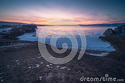 Beautiful sunset over Baikal frozen lake, deepest and biggest fresh water lake in the world in winter season, Siberia, Russia Stock Photo