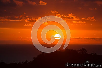 Beautiful sunset over Costa Rica. Red sky. Full disk sun Stock Photo