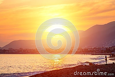 Beautiful sunset over the mountains and the sea, sun glare. The concept of vacation, atmosphere, travel, vacation Editorial Stock Photo
