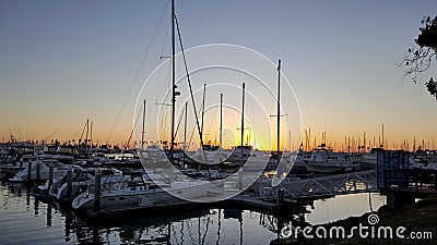 Sailboats Tethered at the Marina Dock at Sunset in San Diego California Stock Photo