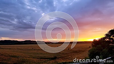 Beautiful sunset over a wheat field Stock Photo