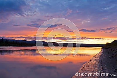 Beautiful sunset over Yukon River near Dawson City Stock Photo