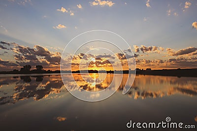 Sunset reflecting off of Grundy County Lake Stock Photo