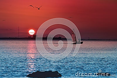 A really beautiful sunset with sailing boat Editorial Stock Photo