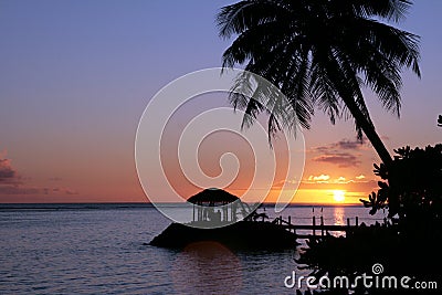 Beautiful sunset on a Samoan beach. Stock Photo