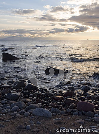 Beautiful sunset on the sandy beach of the Baltic Sea in Lietva, Klaipeda Stock Photo