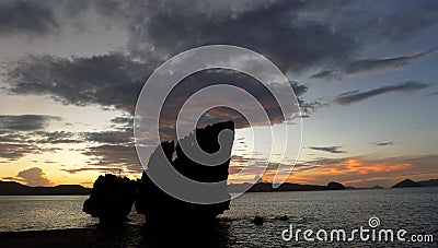 Beautiful sunset with silhouettes of philippine boats in El Nido, Palawan island, Philippines Stock Photo