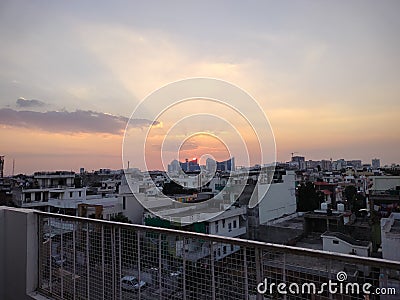 Beautiful sunset with silver lining clouds and orange sky. Stock Photo