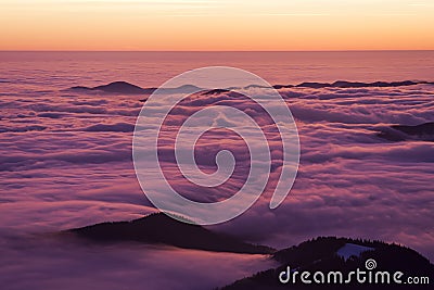 Beautiful sunset or sunrise above the clouds Stock Photo