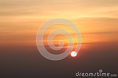 Beautiful sunset or sunrise sky above clouds with dramatic light Stock Photo