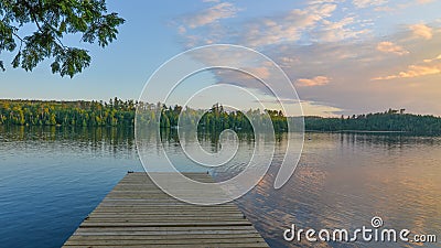Beautiful sunset taken off a dock on Hungry Jack Lake off the Gunflint Trail in Northern Minnesota with a beautiful reflection of Stock Photo