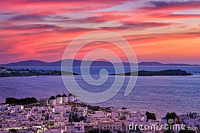 Beautiful sunset view of famous traditional white windmills, Mykonos, Cyclades, Greece. Whitewashed houses, colorful Stock Photo