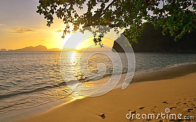 Beautiful sunset on wild beach background islands with setting s Stock Photo