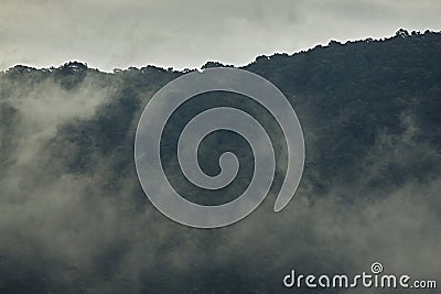 Beautiful sunshine at misty morning mountains Stock Photo