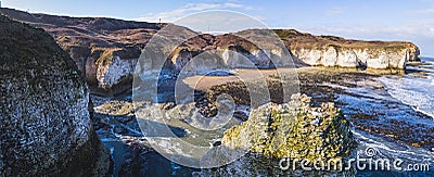 Beautiful sunshine shining over Flamborough Head white chalk cliffs. Panoramic view. Touristic destination concept. Stock Photo