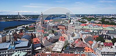 Beautiful super wide-angle panoramic aerial view of Riga, Latvia with harbor and skyline with scenery beyond the city Stock Photo