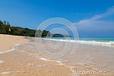 Beautiful Surin beach in Choeng Thale city, Phuket, Thailand with white sand, turquoise water and palm trees Stock Photo