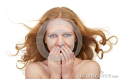 Beautiful surprised woman with flowing hair Stock Photo