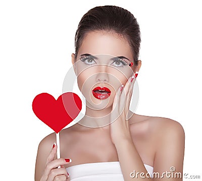 Beautiful surprised woman with glamour bright makeup holding red Stock Photo