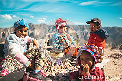 Beautiful Tarahumara kids with mountains and the sunny blue sky in the background in Mexico Editorial Stock Photo