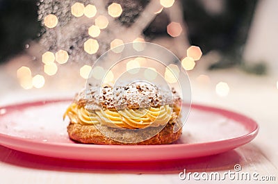 Beautiful tasty cream puff with hazelnuts Stock Photo