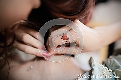 A beautiful tatoo on woman's hand Stock Photo
