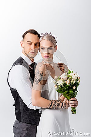 Beautiful tattooed bride and handsome bridegroom Stock Photo