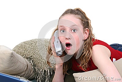 Beautiful Teen on Cellphone Looking Skocked Stock Photo