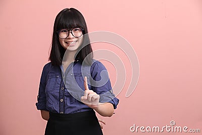 Beautiful teen pointing finger Stock Photo