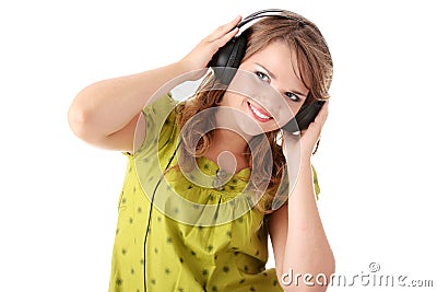 Beautiful teenage girl listening to music Stock Photo