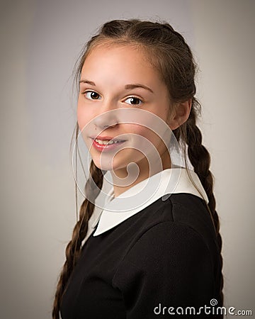 Beautiful Teenage Girl With Plaits Dressed In Black Stock Photo