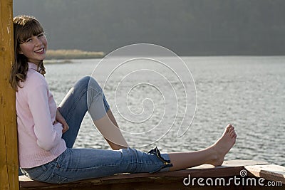 Beautiful teenager over lake Stock Photo