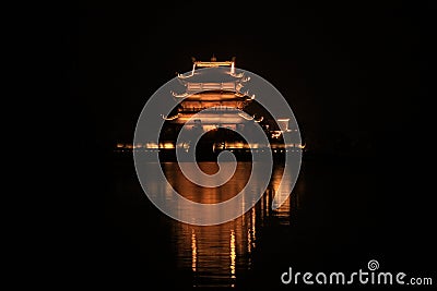 Beautiful temple over lake at night Stock Photo