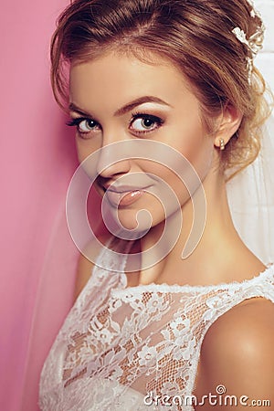 Beautiful tender bride in elegant lace wedding dress Stock Photo