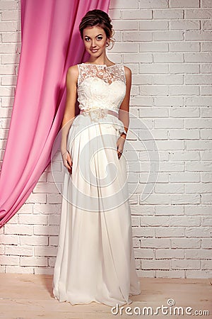 Beautiful tender bride in elegant lace wedding dress Stock Photo