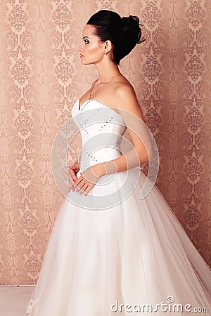 Beautiful tender bride in elegant wedding dress Stock Photo