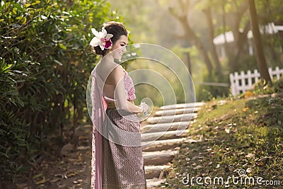 Beautiful Thai girl in Thai traditional costume Stock Photo