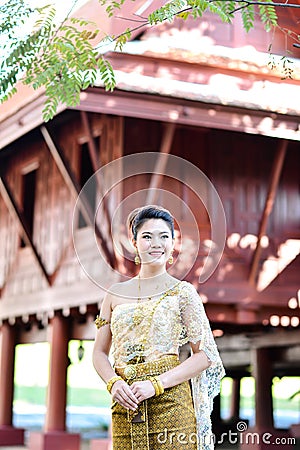 Beautiful Thai girl in Thai traditional costume Stock Photo