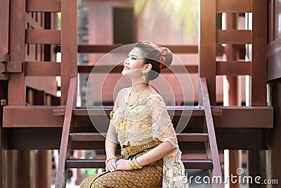 Beautiful Thai girl in Thai traditional costume Stock Photo