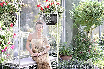 Beautiful Thai girl in Thai traditional costume Stock Photo