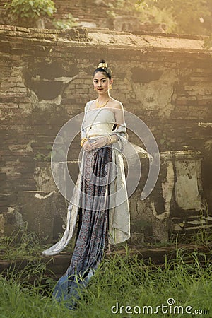 Beautiful Thai girl in Thai traditional costume Stock Photo