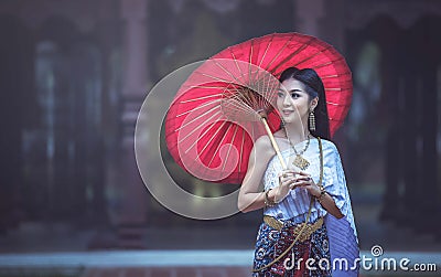 Beautiful Thai woman in Traditional Thai dress Stock Photo