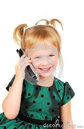 Beautiful three-year-old girl talking on phone. Stock Photo