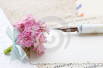 Beautiful tiny bouquet of pink kalanchoe blossfeldiana flowers and vintage letters Stock Photo