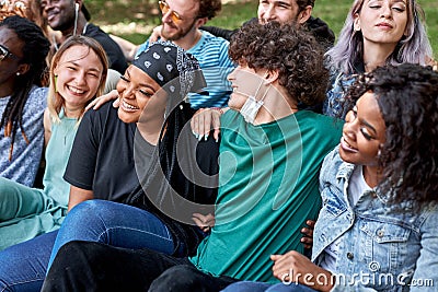 Beautiful tolerant mixed race people gathered together to show that friendship has no race Stock Photo