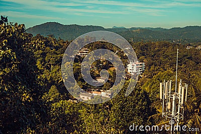 Beautiful top view. Town Kandy. Sri Lanka tourism. Ceylon travel. Ecotourism concept. Hotel building, guest house in jungle. Stock Photo