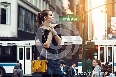 Beautiful tourist girl traveling and enjoying busy city life of New York City. Stock Photo