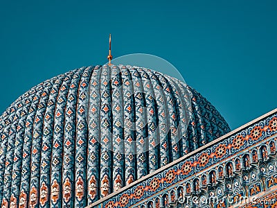 Beautiful tower of the mosque against the blue sky Stock Photo