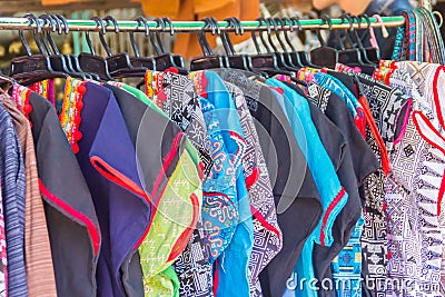 Beautiful traditional handmade clothes for sale to the tourist as the souvenir at the local market in hill tribe minority village Stock Photo